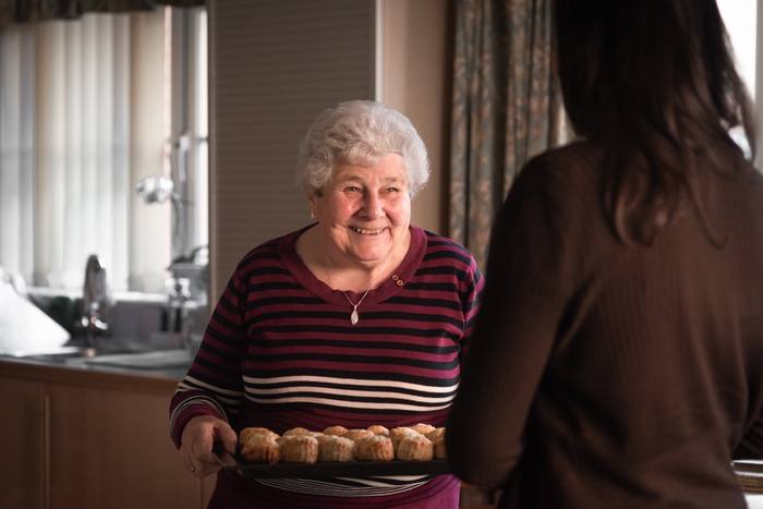 Client at home baking scones